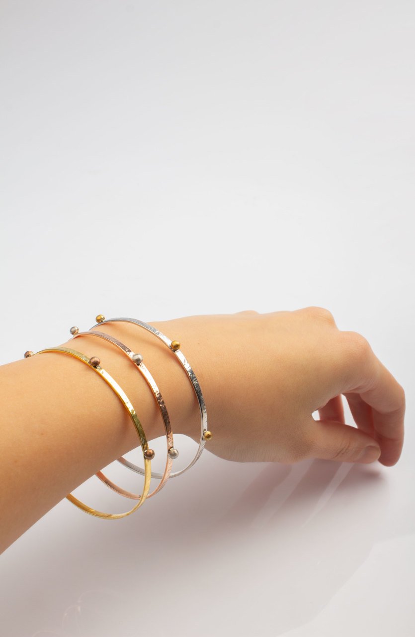 Hand Hammered Bracelet with Bombs